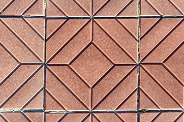 Yellow square-shaped pavement tiles.Beautiful quality texture closeup.Symmetrical pattern.
