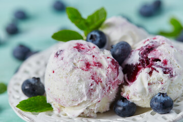 blueberry ice cream on turquoise surface