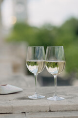 Wedding accessories. Two glasses of champagne, a bouquet of flowers and shoes