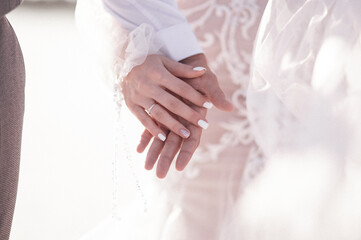 Man and woman hold hands close up. Hands of man and woman close up.