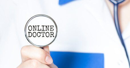 Doctor holding a stethoscope with text ONLINE DOCTOR, medical concept
