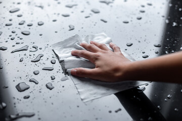 Cleaning liquid water drops with wipe