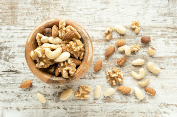 Dry fruits and nuts at wooden table