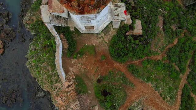 View from above. Flying over the picturesque Rudny lighthouse in the village of Rudnaya Pristan, Primorsky Territory. Landmark of Primorsky Krai