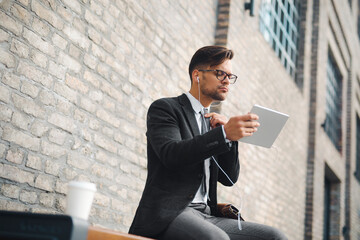 Businessman fixing tie