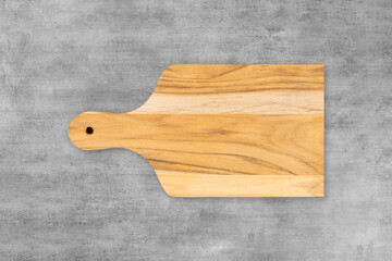 Wooden cutting kitchen Board, isolated on wooden table background. Top view