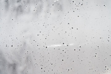 texture of auto shampoo on an even car with air bubbles