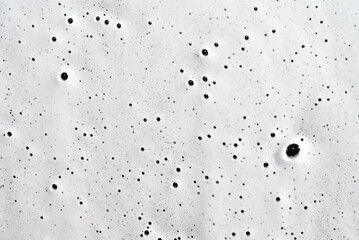 texture of auto shampoo on an even car with air bubbles