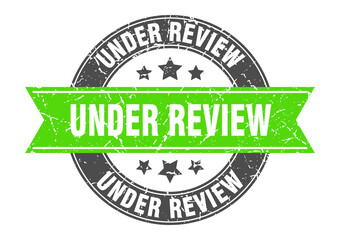 under review round stamp with ribbon. label sign