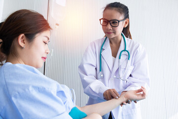 Doctor with female patient in hospital.Doctor giving a consultation woman about illness.Asian doctor woman,depression.Photo concept Health and Patient.