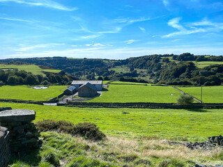 Landscape view from, Corporal Lane, with fields, meadows, dry stone walls and trees in, Bradford, Yorkshire, UK