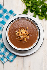 Mexican cream of bean soup on white background