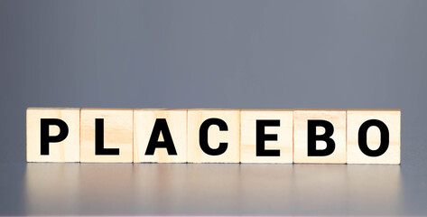 Placebo word written on blocks. Placebo effect, fake medical treatment