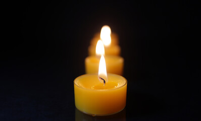 Many Candle Lights Lined Up, Selective Focus, Warm Background