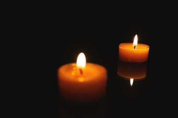 Fototapeta na wymiar Two Candle Lights And Selective Focus, Warm Background