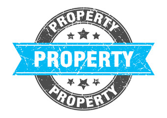 Fototapeta premium property round stamp with ribbon. label sign