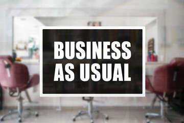Business as Usual sign of a salon or beauty parlor. Concept of resumption or confidence in operations.
