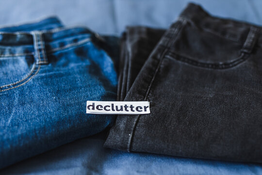 Declutter label on different jeans in various denim colors, tidying up concept