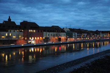 Night view of townscape by river in Germany. 