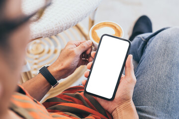cell phone mockup blank white screen.man hand holding texting using mobile on desk at coffee shop.background empty space for advertise.work people contact marketing business,technology