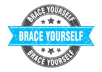 Fototapeta premium brace yourself round stamp with ribbon. label sign