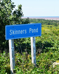 Road sign for the village of Skinner's Pond in Prince Edward Island, known as the childhood home of Stompin' Tom Connors