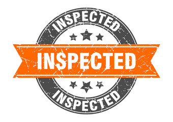 inspected round stamp with ribbon. label sign