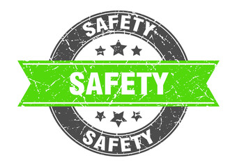 Obraz premium safety round stamp with ribbon. label sign
