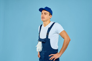 Working man in uniform of gloves loader rendering service blue background