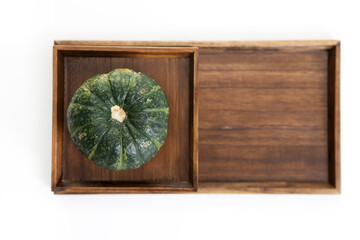 pumpkin on wooden tray