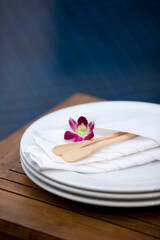 wooden spoon on pile of plates
