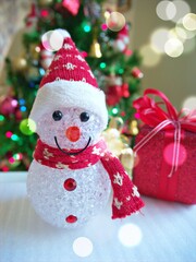 Merry christmas background tree with gifts and decorations for happy new year ,gift box, balls ,snow man, candle for celebration and card design