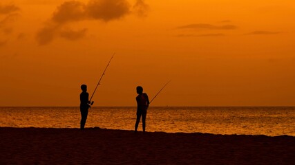 fishing at sunset