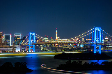 Fototapeta na wymiar Blue bridge Tokyo that actually it's called Rainbow Bridge