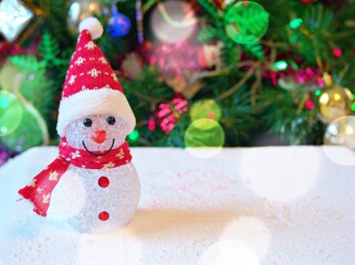 Merry christmas background tree with gifts and decorations for happy new year ,gift box, balls ,snow man, candle for celebration and card design