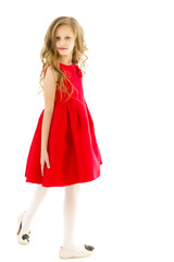 Full Length Portrait of Pretty Preteen Girl Standing Looking to Side.