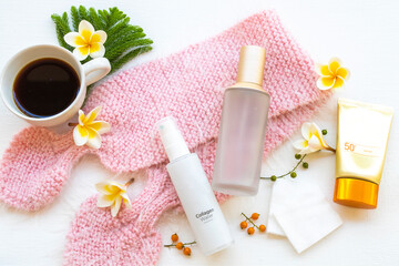 sunscreen spf50 ,serum toners ,collagen water spray cosmetics health care for skin face ,hot coffee and  knitting wool of lifestyle woman relax in winter season arrangement flat lay style 