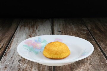 Traditional fresh soft custard cake on the plate. Famous baked sweet dessert and snack in party or ceremony. Classic supper concept. 