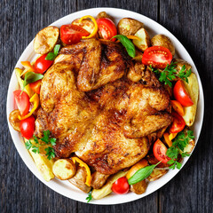 roast chicken served with vegetables on a platter