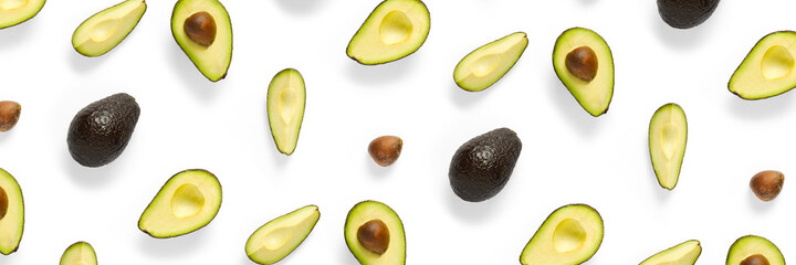 Avocado banner. Background made from isolated Avocado pieces on white background. Flat lay of fresh ripe avocados and avacado pieces.