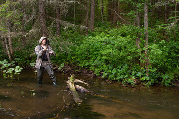 angler with a spinning rod made a hooking of fish