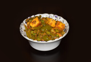 Indian Bengali traditional mix vegetable dish served on a white bowl