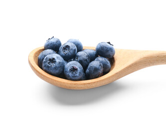 Tasty ripe blueberry in spoon on white background
