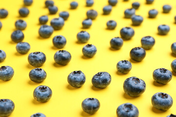 Tasty ripe blueberry on color background