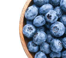 Tasty ripe blueberry in bowl on white background, closeup