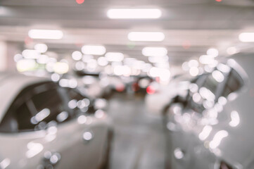Abstract blurred a cars in parking lot in shopping mall.