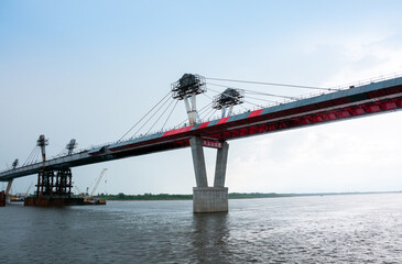 Russia, Blagoveshchensk, July 2019: Bridge on the Amur river from Blagoveshchensk to the Chinese city of Heihe in summer