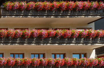 Typical flowered balconies of Tyrol and the Alpine areas on the border between Italy and Austria