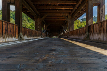 Fototapeta na wymiar The historical old wooden bridge in Forbach, Black Forest, Germany