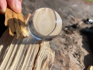 hands holding tin can